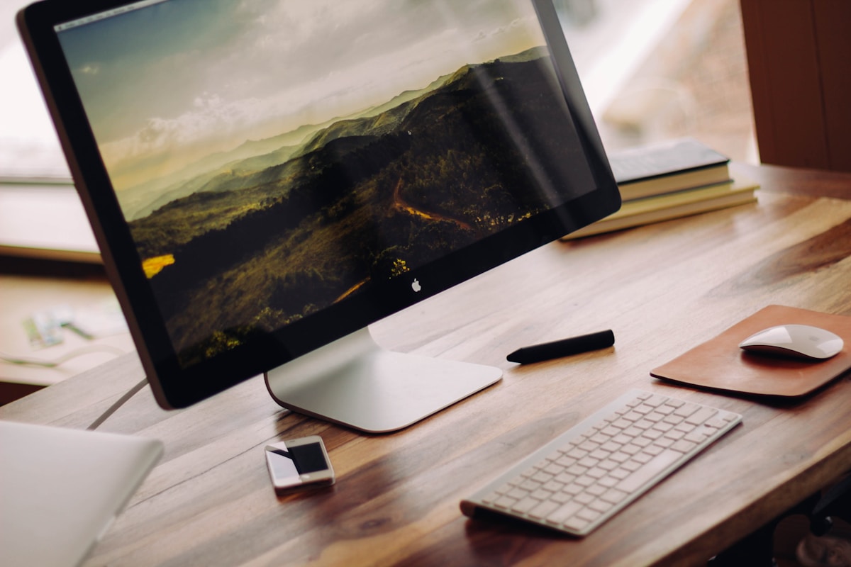 Computer workstation with desktop display and laptop